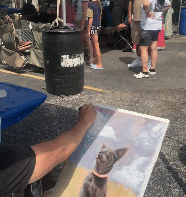 an ani-mal's design artist painting a personalized dog portrait on a canvas