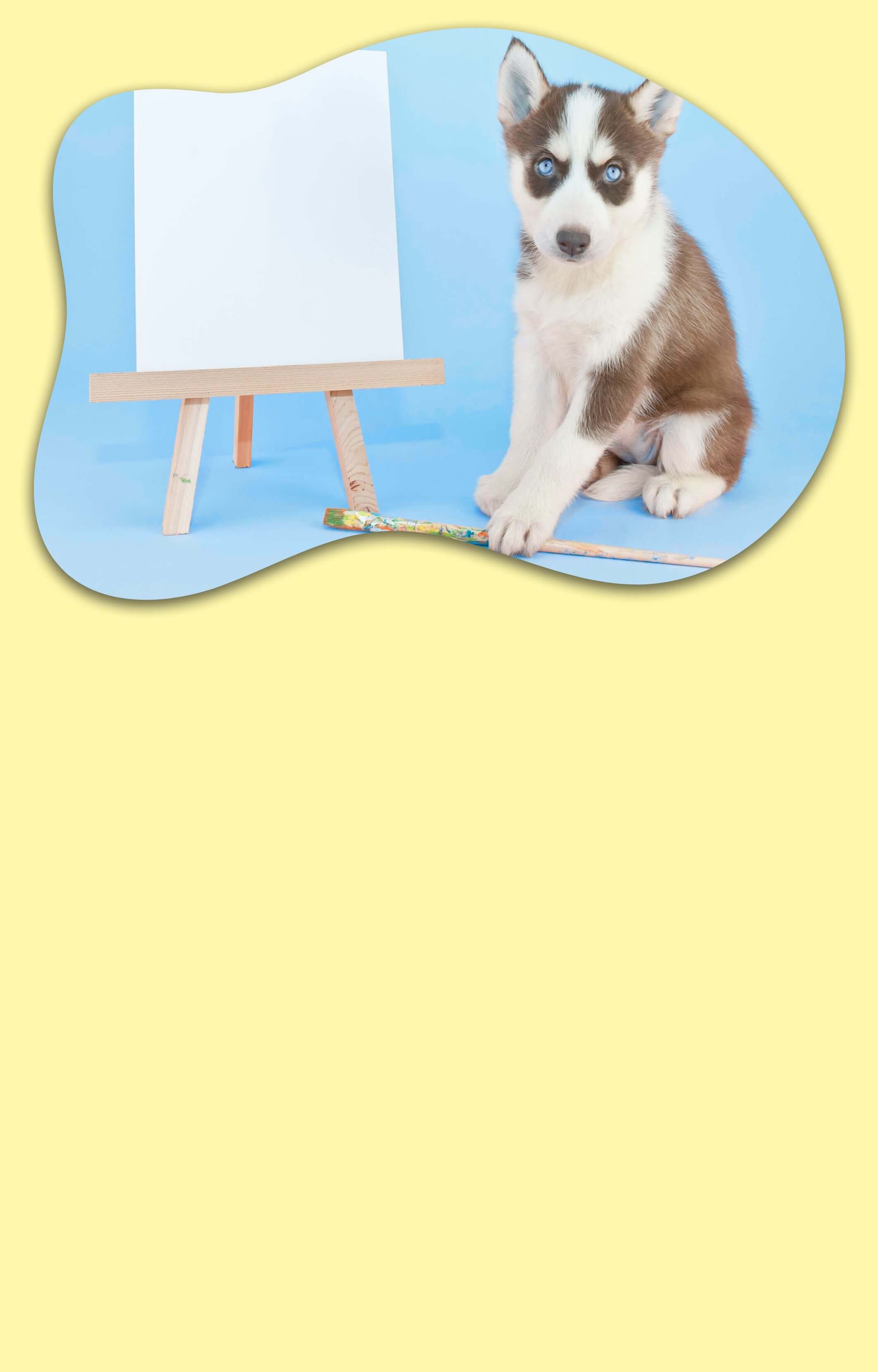 A yellow background with a dog on the side sitting next to a canvas and paint brush waiting for his personalized pet portrait